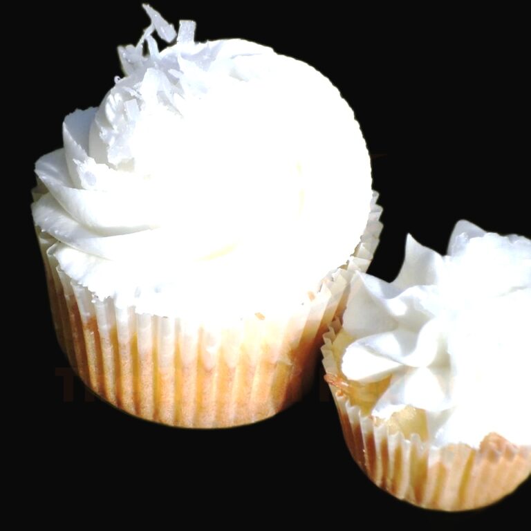 Delicious Coconut Cupcakes With Almond Cream Frosting